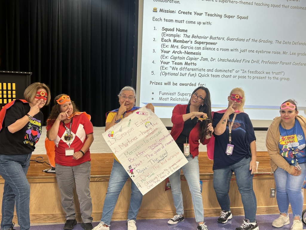 Kinder Grade teachers holding Super Power Poster