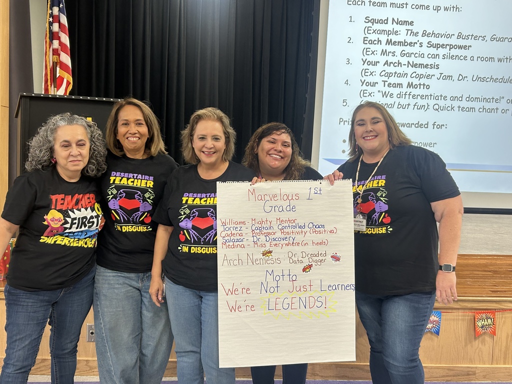 First  Grade teachers holding Super Power Poster