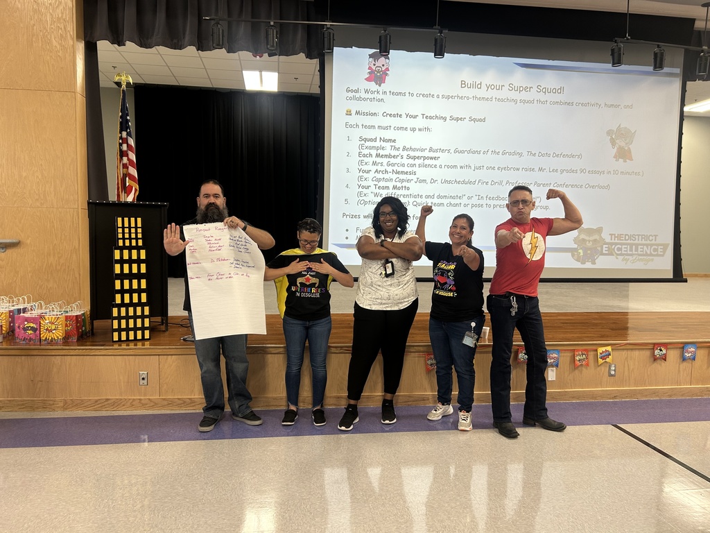 Teachers holding Super Power Poster