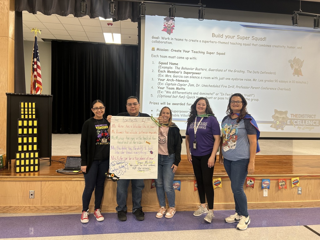 Fourth Grade teachers holding Super Power Poster