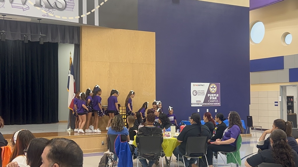 Desertaire Cheerleaders cheering on stage for teachers,