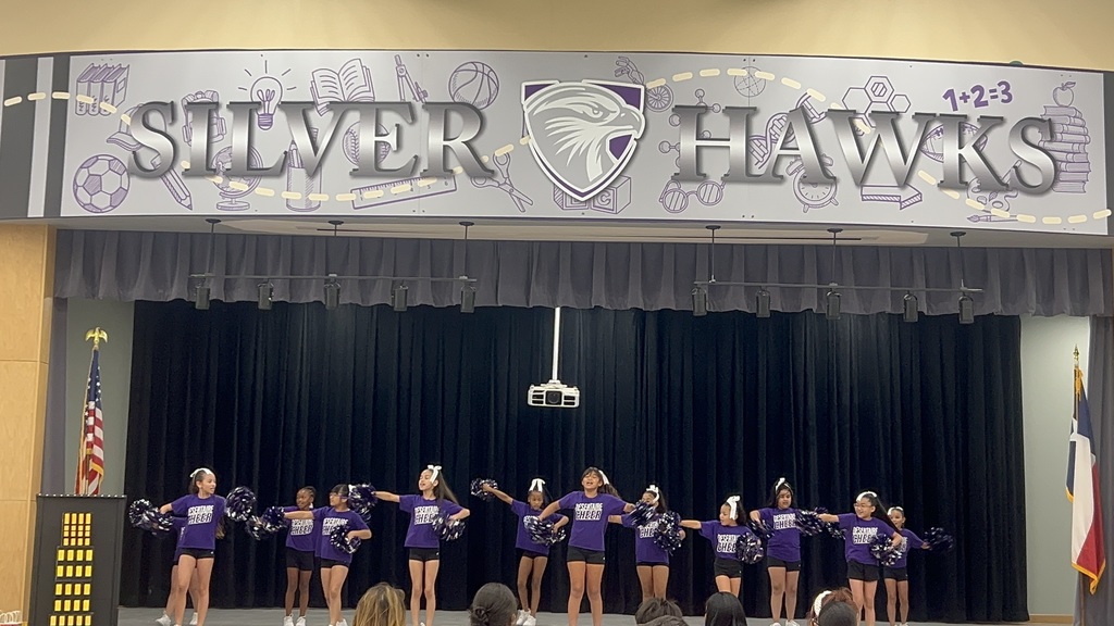 Desertaire Cheerleaders cheering on stage for teachers,