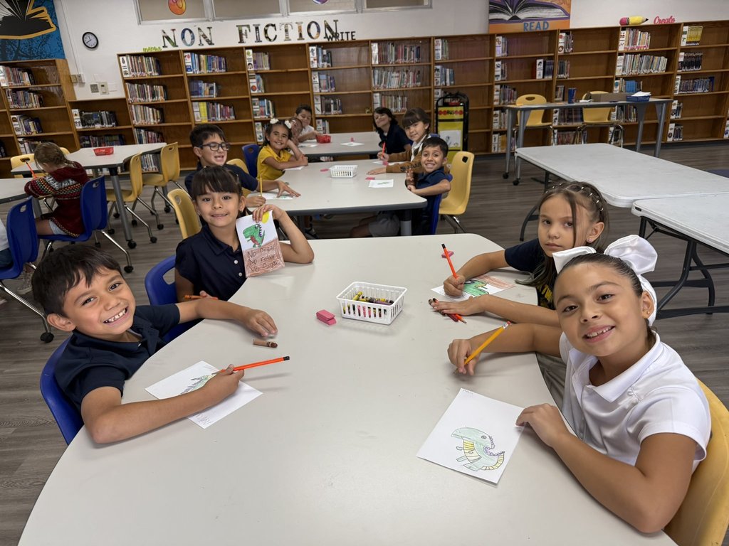 Students illustrating and writing what not to do at school.