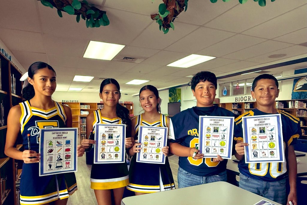 Photo of EKIS students completing a scavenger hunt in the library.