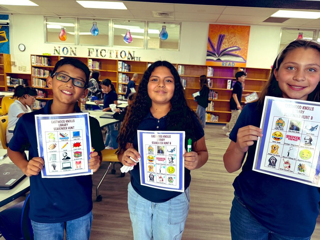 Photo of EKIS students completing a scavenger hunt in the library.