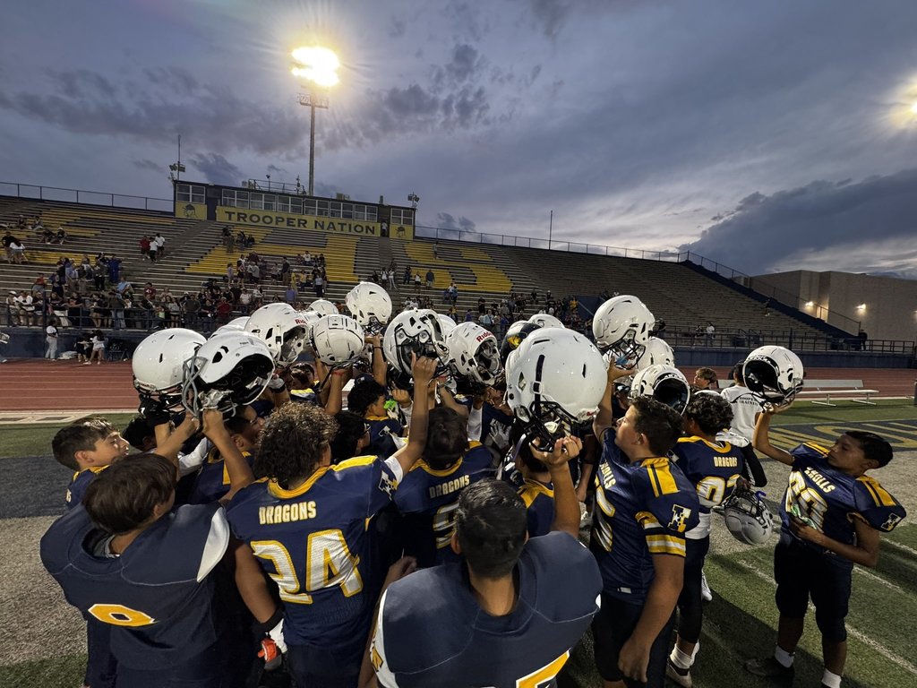 Photo of EKIS football players post game cheer.