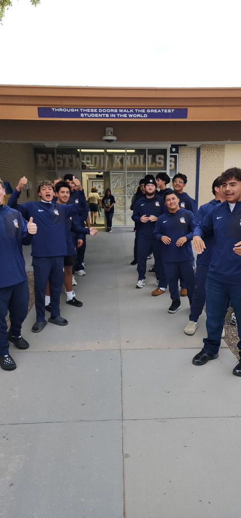 Photo of EKIS students being welcomed to school by EKIS NJHS and EHS Football players.