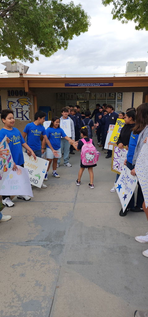 Photo of EKIS students being welcomed to school by EKIS NJHS and EHS Football players.
