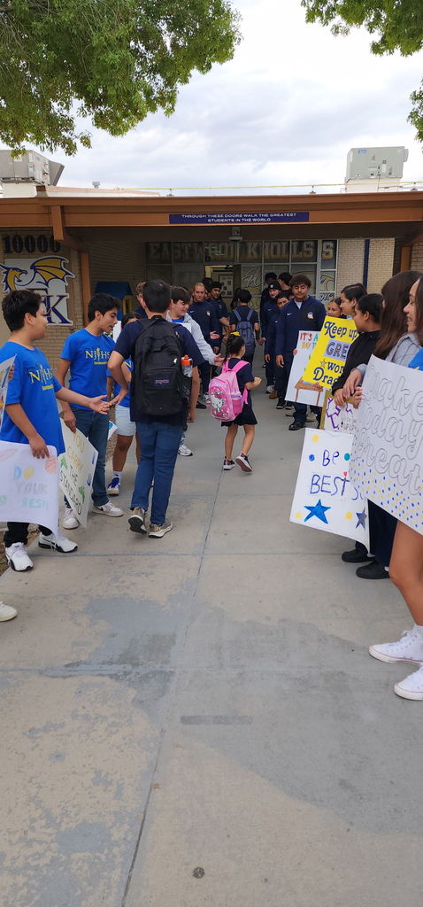 Photo of EKIS students being welcomed to school by EKIS NJHS and EHS Football players.