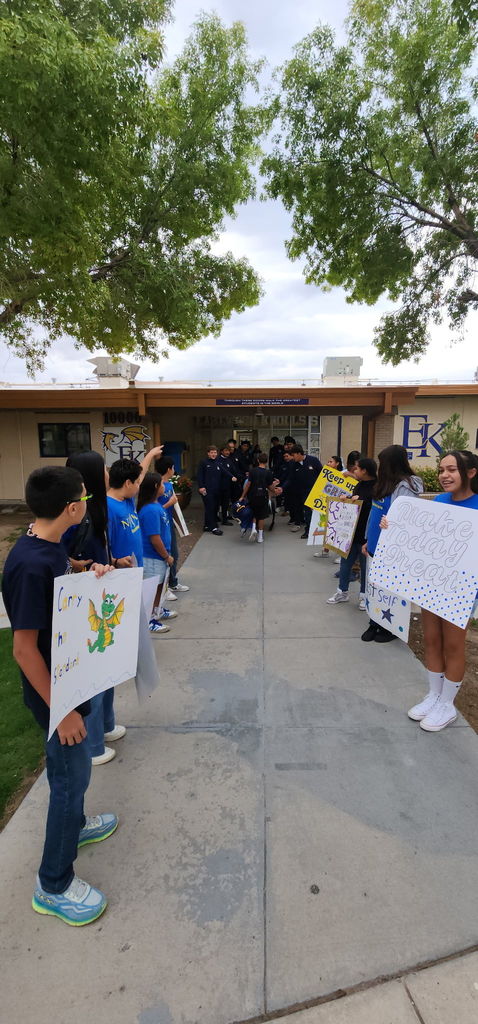 Photo of EKIS students being welcomed to school by EKIS NJHS and EHS Football players.