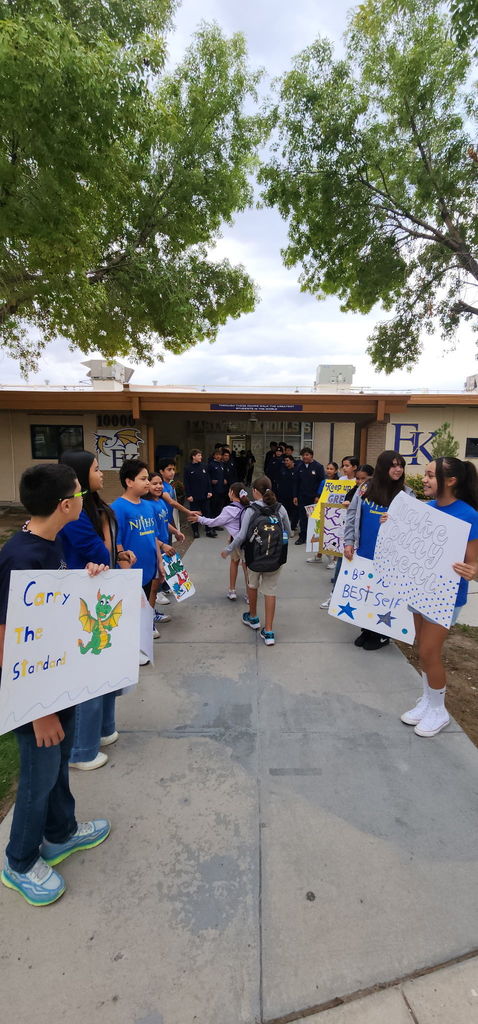 Photo of EKIS students being welcomed to school by EKIS NJHS and EHS Football players.