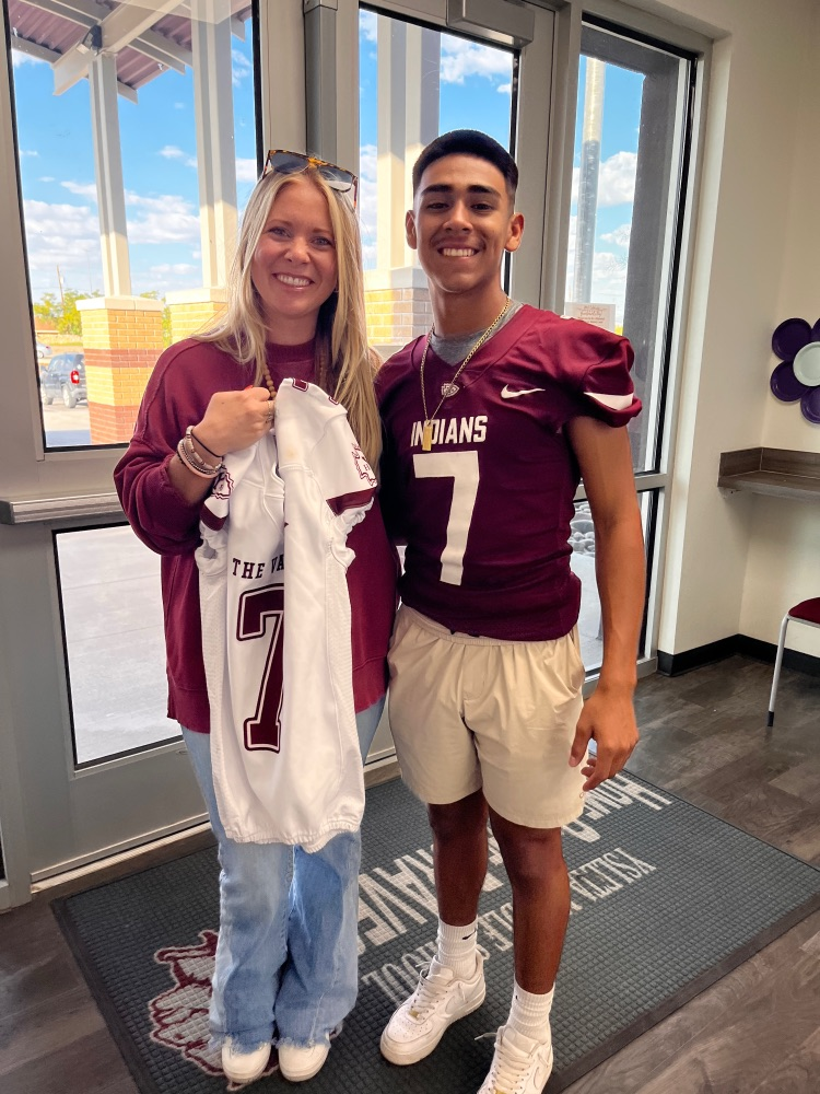 Ms. Boyett 7th grade Science teacher with YHS football player