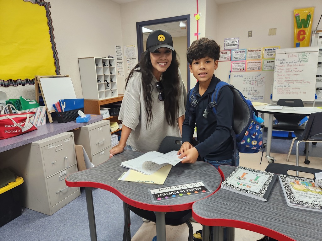 Student leading a conference with his mom