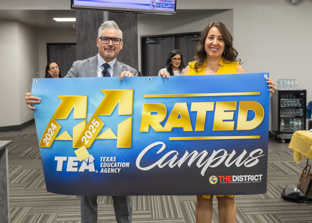 Mrs. Alarcon and Dr. De la Torre hold the back-to-back A-Rated campus banner for our school