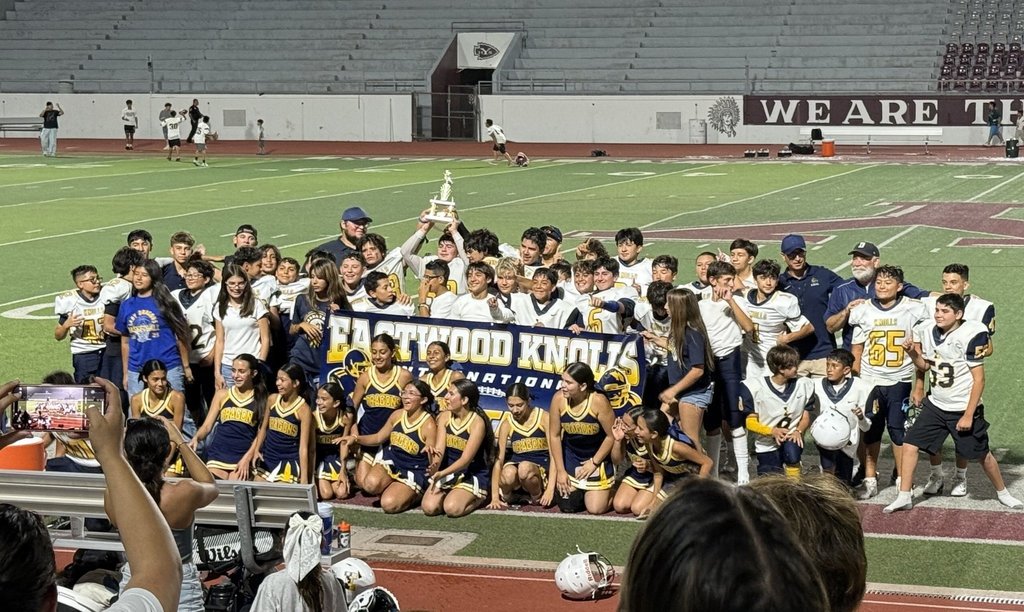 Photo of EKIS football players celebrating a victory.