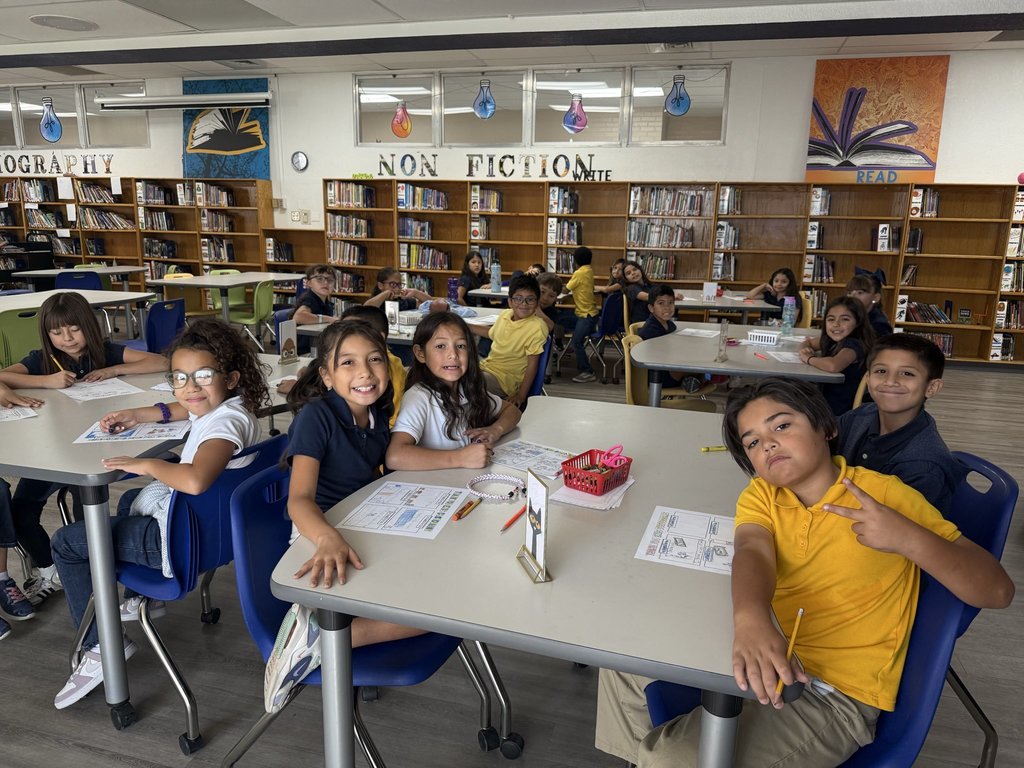 Image of EKIS students writing thank you notes to school custodians.