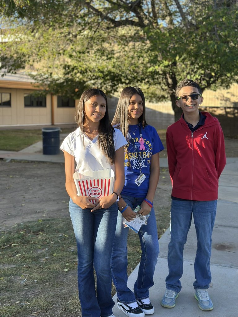 EKIS NJHS members distributing information to parents as they drop off their kids at school.