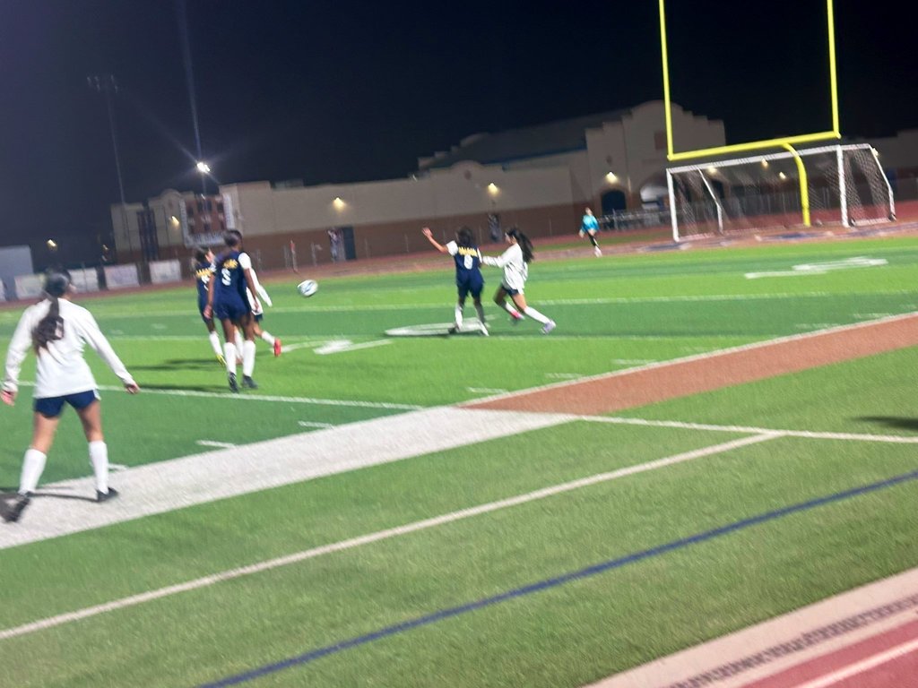 EKIS girls soccer players at a game.