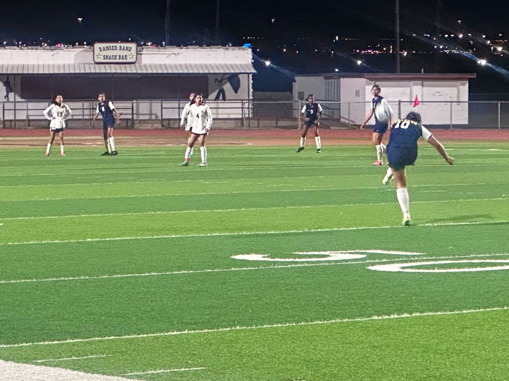 EKIS girls soccer players at a game.