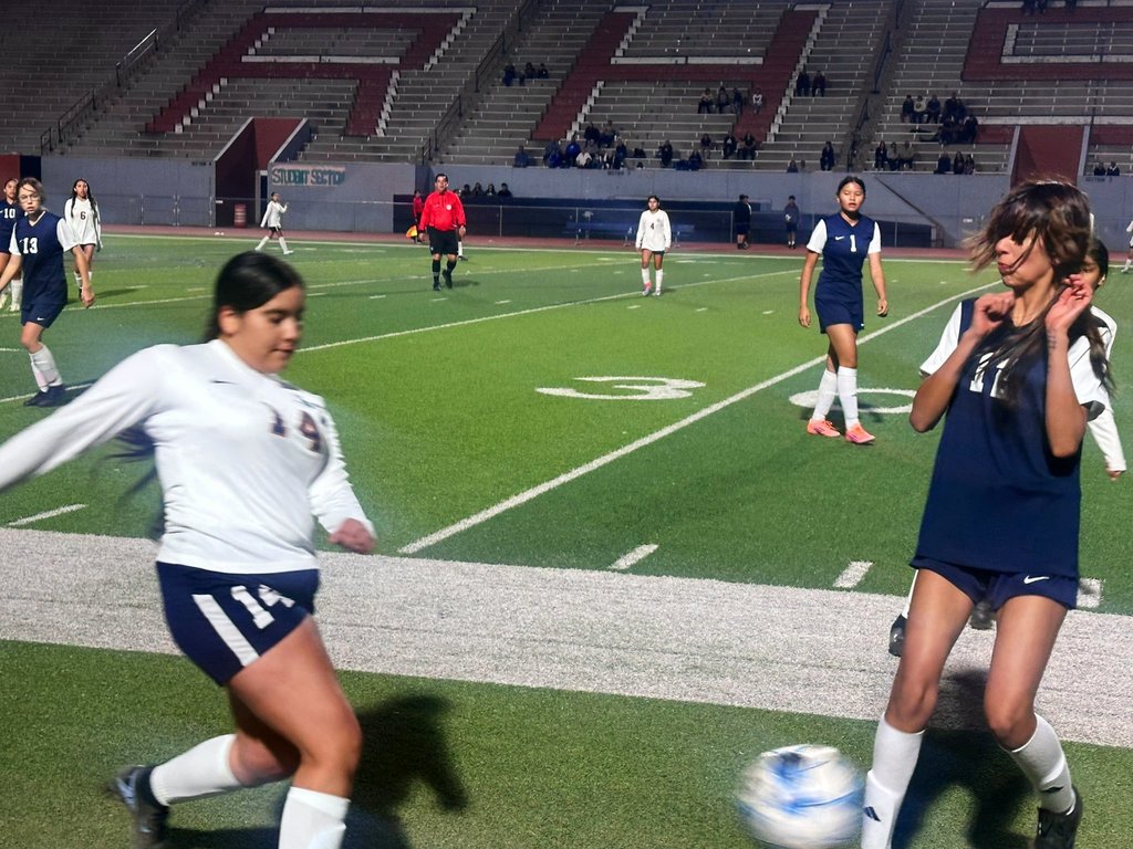 EKIS girls soccer players at a game.