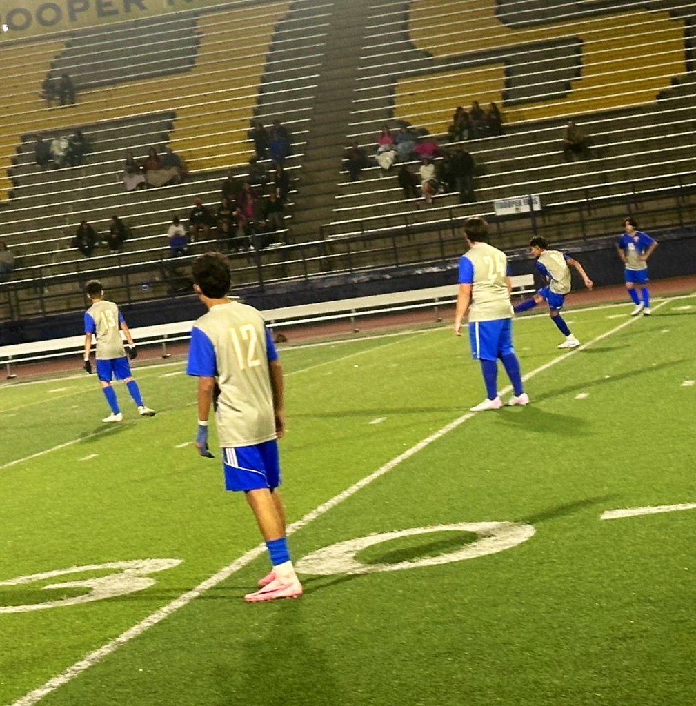 Photo of EKIS soccer players at a game.