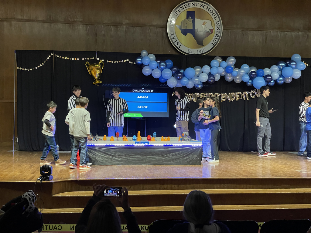 Photo of EKIS robotics team at a robotics tournament.