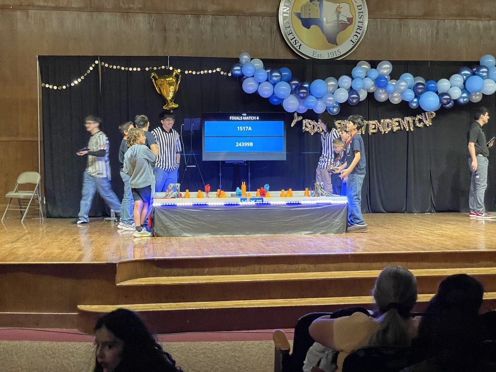 Photo of EKIS robotics team at a robotics tournament.