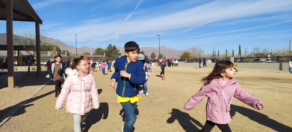 Students are running laps to collect sticks to see who will have the most.