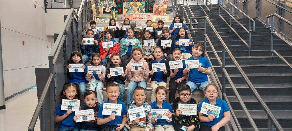 Students pose for a picture for receiving Dolphin of the Week award. 