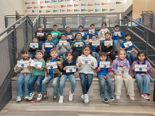 Students who won Dolphin of the Week are posing for a group picture.