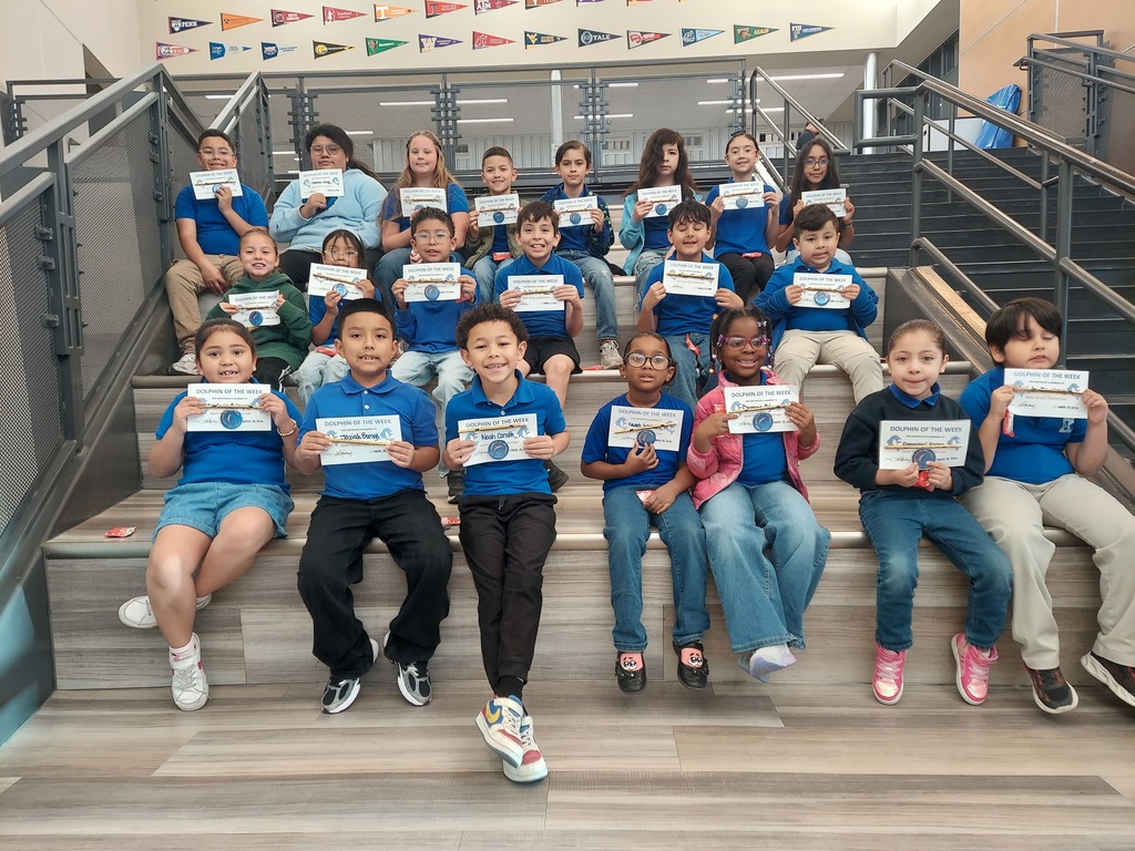 Students pose for a picture for being the Dolphin of the Week.