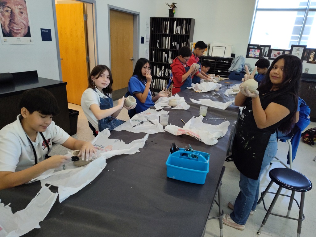 Students in Mr. Borunda's Art Class creating clay pinch pots and digital radial mandalas