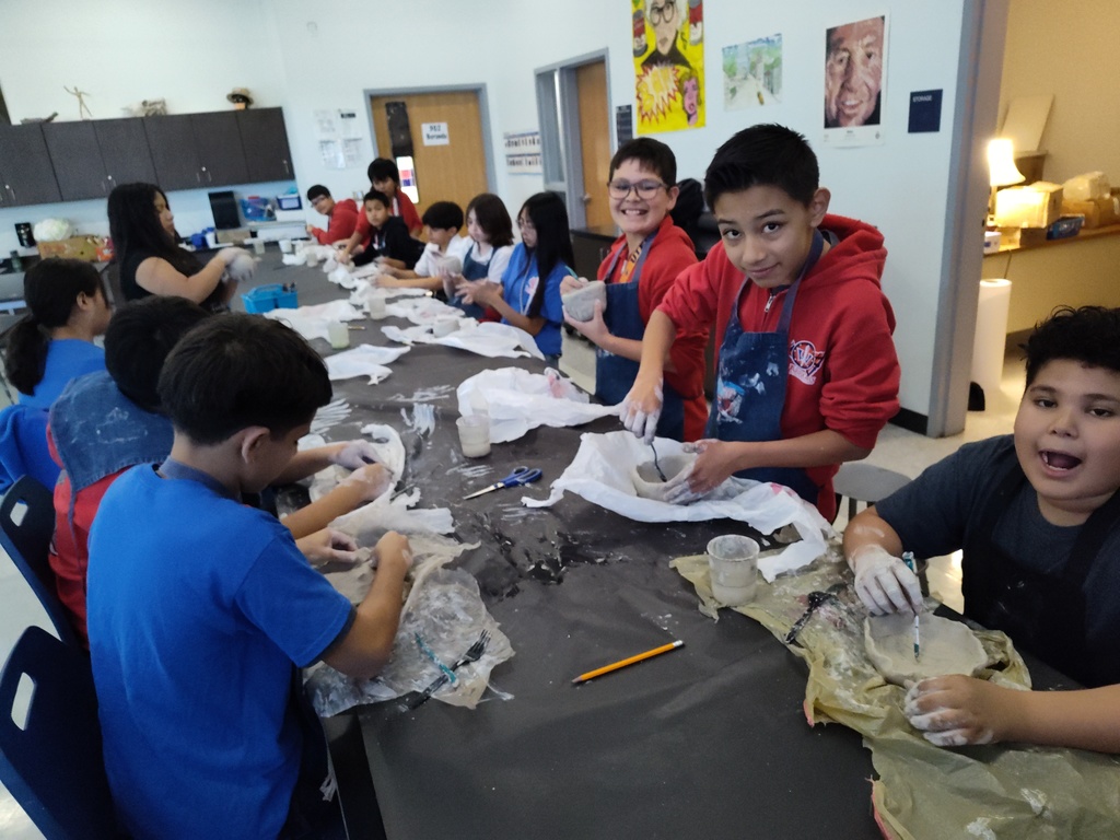 Students in Mr. Borunda's Art Class creating clay pinch pots and digital radial mandalas