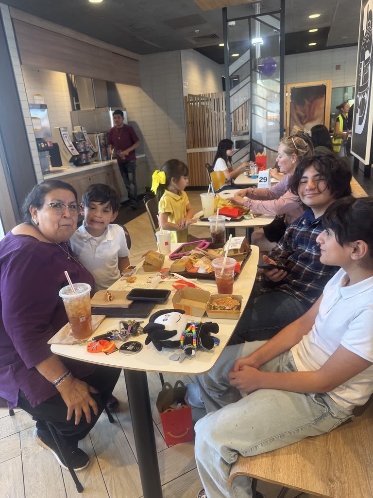 Photo of EKIS faculty, students, and community at Mc. Donald's for a fundraiser.