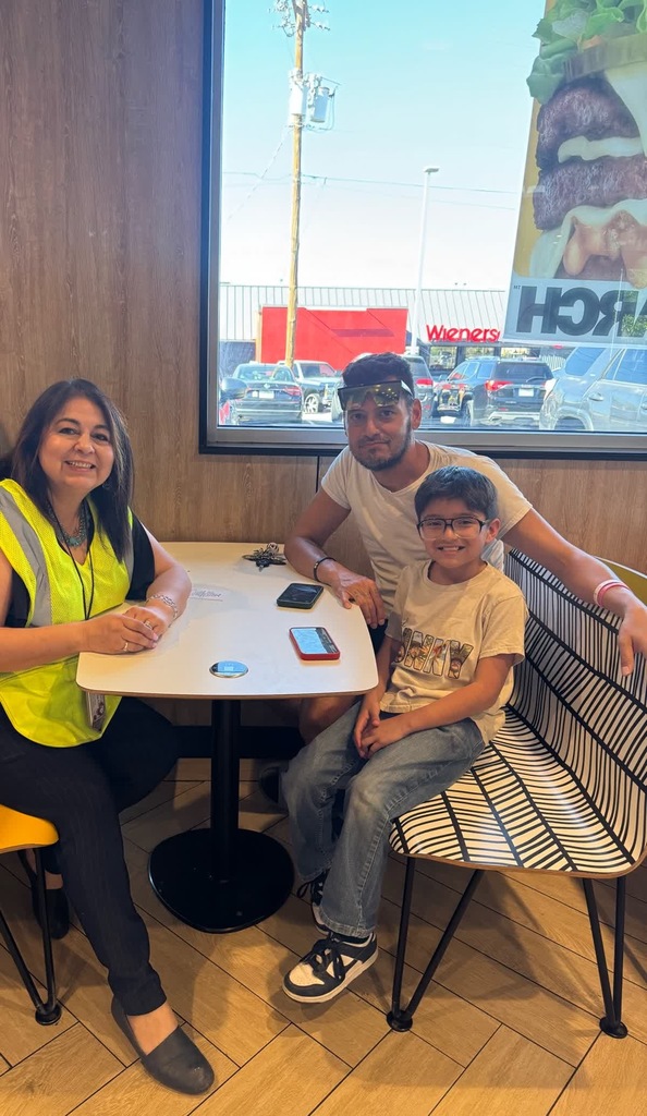 Photo of EKIS faculty, students, and community at Mc. Donald's for a fundraiser.