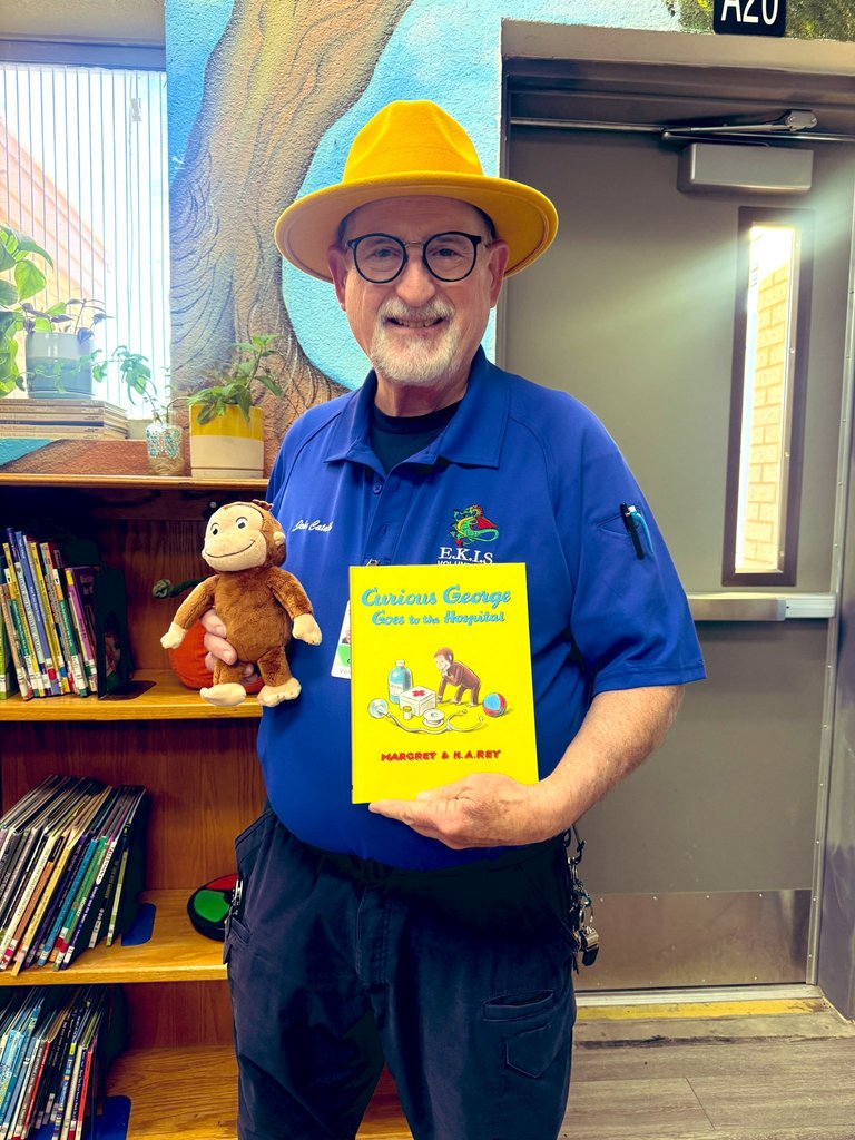 Photo of Mr. Cataldi ready to read to Kinder students.