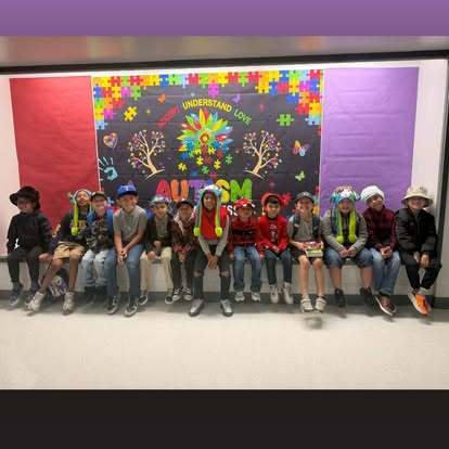 Students wearing hats for Autism awareness week