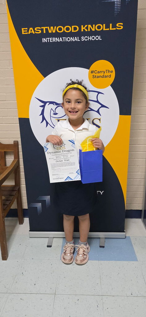 EKIS student receiving a Dynamic Dragon Certificate.