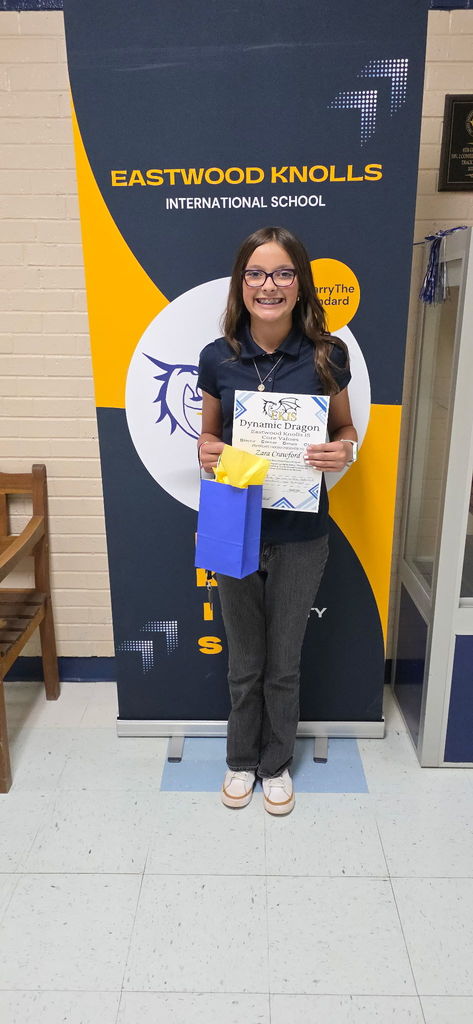 EKIS student receiving a Dynamic Dragon Certificate.