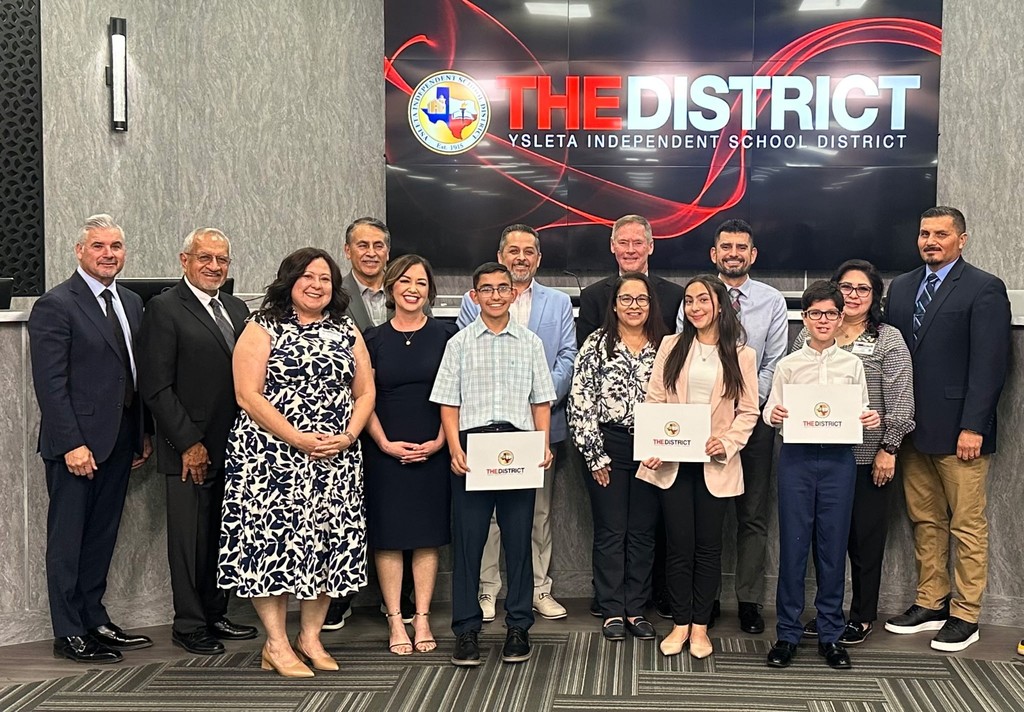 Photo of YISD students being recognized by the school board.