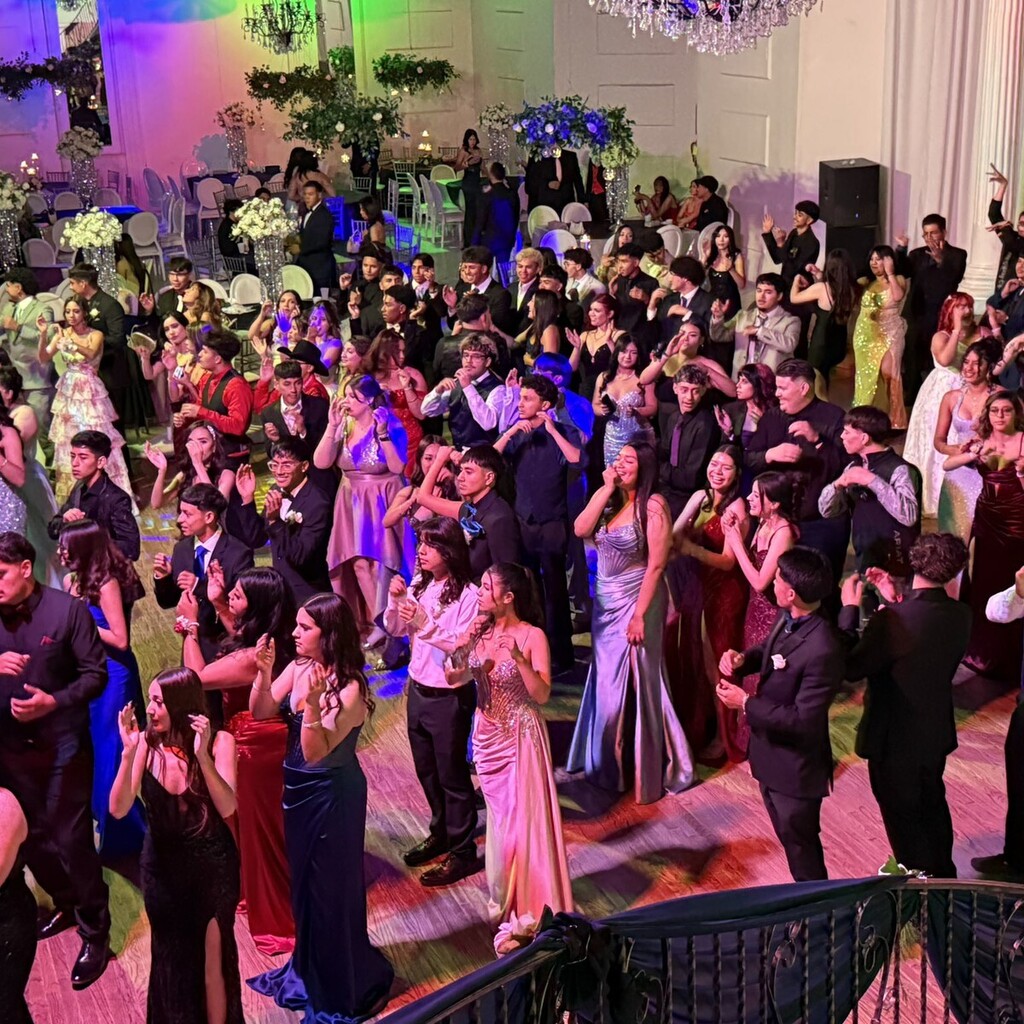 students dancing on ballroom floor for junior and senior prom