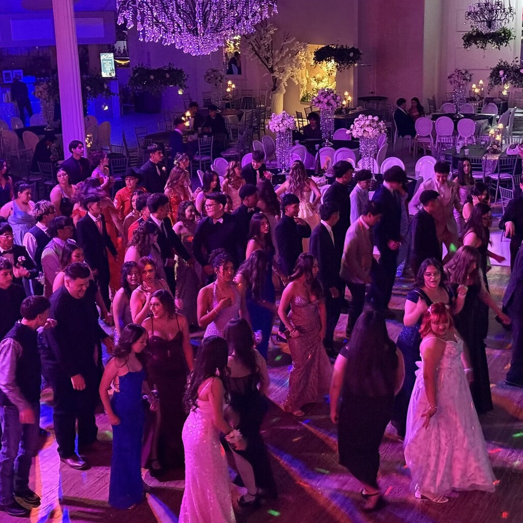 students dancing on ballroom floor for junior and senior prom