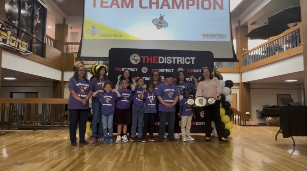 Desertaire teachers and students posing with the winning belt