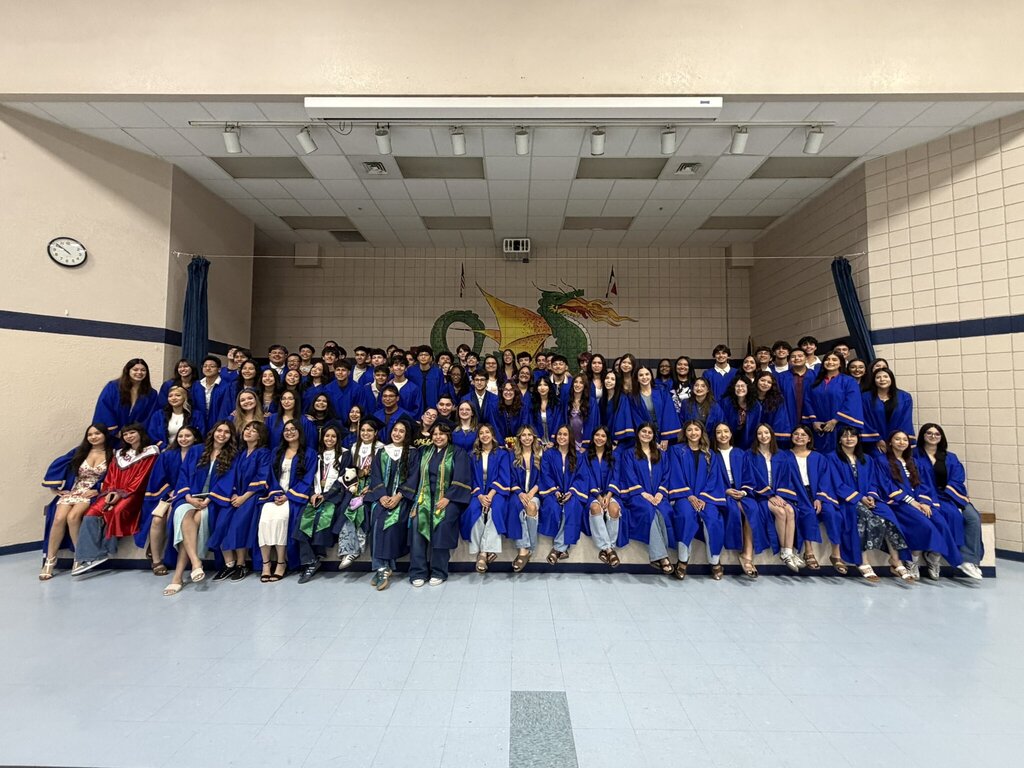 A class photo of High School seniors from Eastwood High School, Bel Air High School, and YWLA visiting Eastwood Knolls on Senior Day dressed in their high school robes.