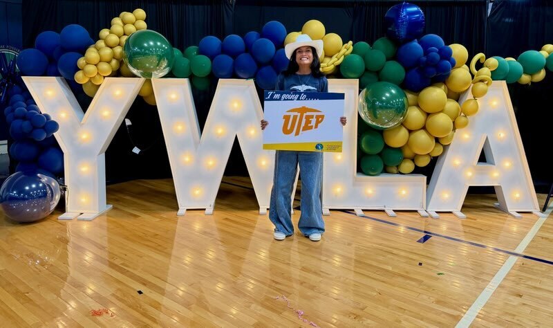 senior signing with slide celebration for class of 2026 student image