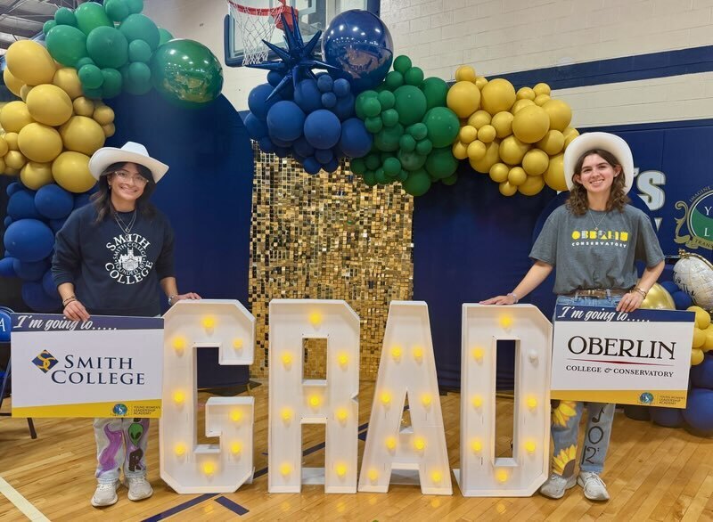 senior signing with slide celebration for class of 2026 student image
