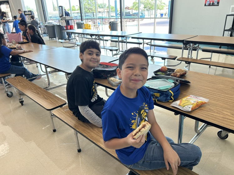 two boys posing at table 