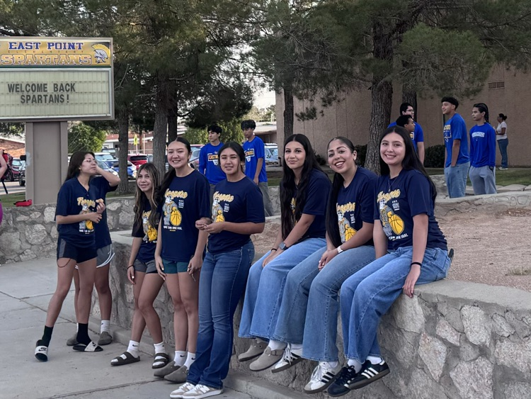 girls’  basketball team waiting to welcome students 