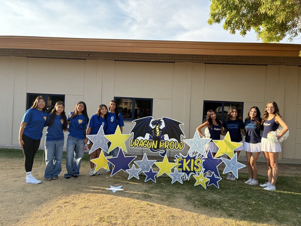 Photo of Eastwood High School soccer players and Cheerleaders welcoming in Eastwood Knolls students at the main entrance early on Friday morning.