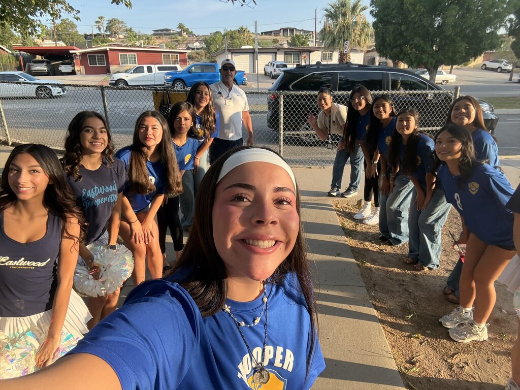 Photo of Eastwood High School soccer players and Cheerleaders welcoming in Eastwood Knolls students at the main entrance early on Friday morning.